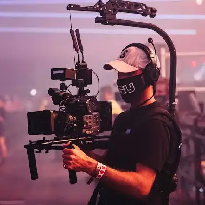 Videographer filming a wedding event